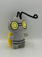 Load image into Gallery viewer, Little grey monster plush with yellow eyes and black stripes on his body. He has long thin black antenna and a yellow coin on his back!