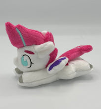 Load image into Gallery viewer, White horse plush laying on belly with pink lightning bolt on flank and pink with blue stripe hair. Eye is blue. Has purple tipped wings and silver hooves.
