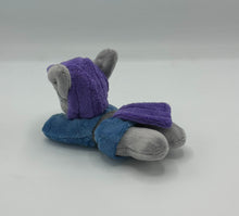 Load image into Gallery viewer, Grey horse plush laying on belly with purple hair. Eye is blue. Wears a blue dress with a grey belt
