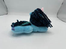 Load image into Gallery viewer, Blue horse plush laying on belly with blue yarn hair. Eye is green. Has a pink horn 
