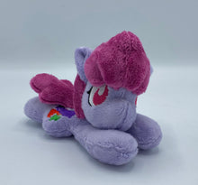 Load image into Gallery viewer, Purple horse plush laying on belly with colorful fruit on flank and maroon hair. Eye is red.
